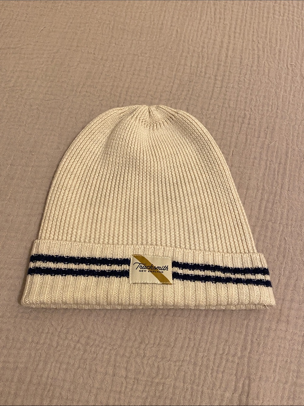 Tracksmith Merino Wool Cream Beanie with Navy Stripe Detail